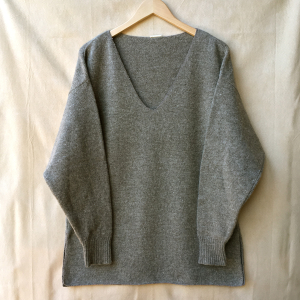 serged-edge tunic-length sweater